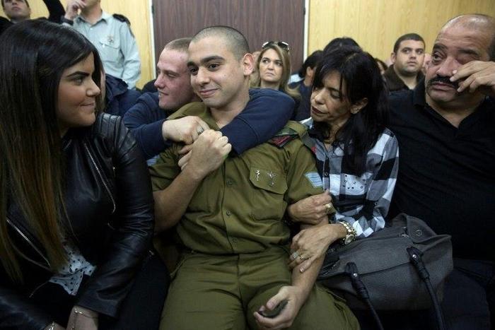 Israeli soldier Elor Azaria (C), was convicted of manslaughter after a trial in a military court which deeply divided the country