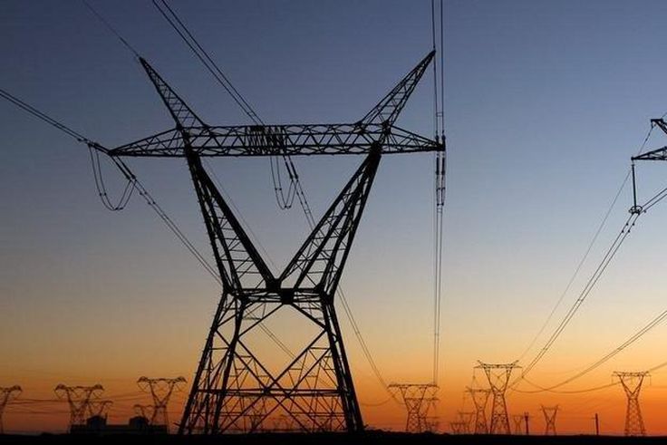Electricity pylons carry power from Cape Town's Koeberg nuclear power plant, South Africa. REUTERS/Mike Hutchings