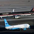Republican presidential nominee Donald Trump's plane passes Democratic presidential nominee Hillary Clinton's campaign plane at McCarran International Airport, in Nevada, on October 18, 2016