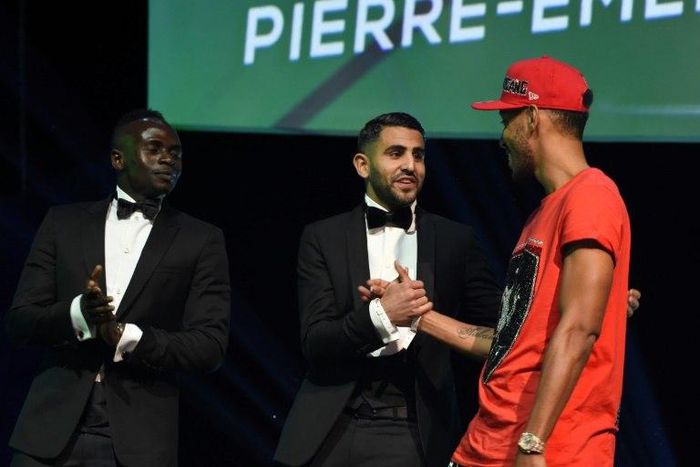 While his peers were dressed formally at African football's glitzy annual award ceremony, lost luggage forced Pierre-Emerick Aubameyang (R) into casual clothing