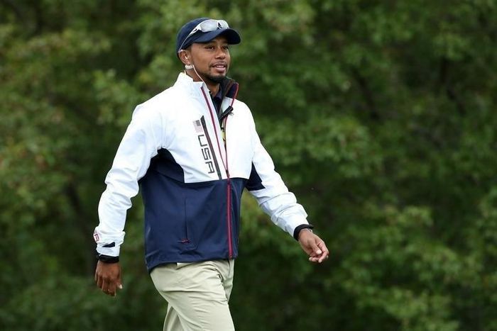 Team USA vice-captain Tiger Woods walks the 10th green during the practice round for the Ryder Cup at Hazeltine National Golf Club. Mandatory Credit: Rob Schumacher-USA TODAY Sports