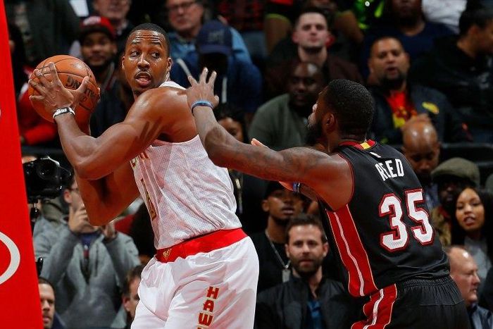 Dwight Howard of the Atlanta Hawks grabs a rebound against Willie Reed of the Miami Heat at Philips Arena on December 7, 2016