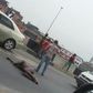 Man strips and lies down in the middle of major road