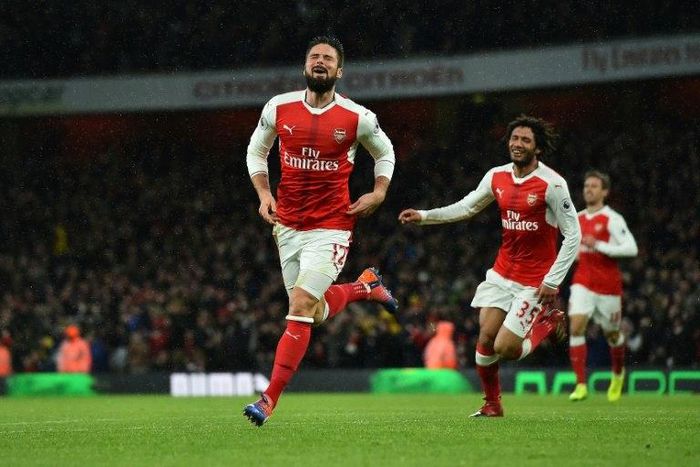 Arsenal's striker Olivier Giroud celebrates scoring his team's first goal during the English Premier League football match against Crystal Palace at the Emirates Stadium in London on January 1, 2017