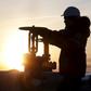 Worker checks valve of oil pipe at Lukoil company owned Imilorskoye oil field outside West Siberian city of Kogalym