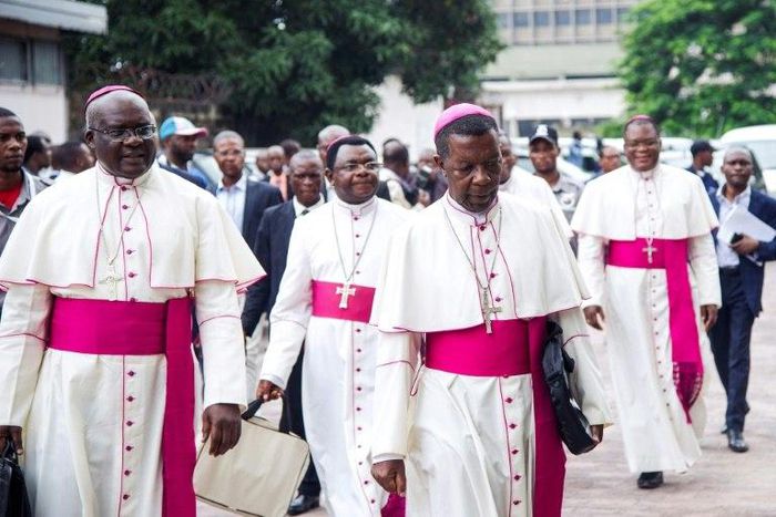 Catholic bishops arrive for the signing of an accord at the inter diocesan centre in Kinshasa on January 1, 2017 following talks launched by the Roman Catholic Church between the government and opposition