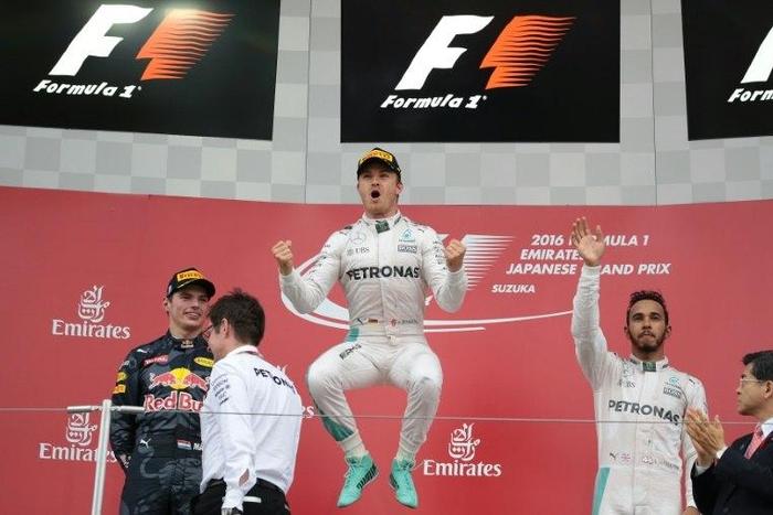Nico Rosberg (C) claimed his first Suzuka win from pole as Lewis Hamilton took third after a dreadful start