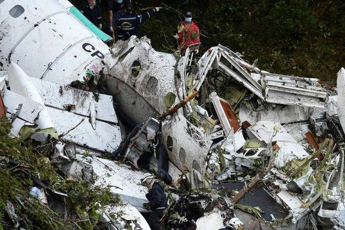 Rescue teams work on the recovery of bodies of victims of the crash in Colombia, on November 29, 2016