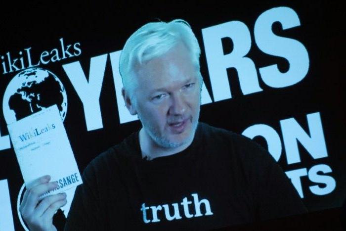 Julian Assange, founder of WikiLeaks, addresses journalists via a live video feed on October 4, 2016 in Berlin