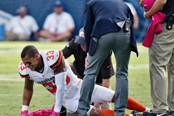 Jordan Poyer of the Cleveland Browns is attended to by medical staff after receiving an illegal hit by Antonio Andrews of the Tennessee Titans on October 16, 2016