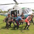 The injured security personnel arrive at a medical facility via a presidential airlift.