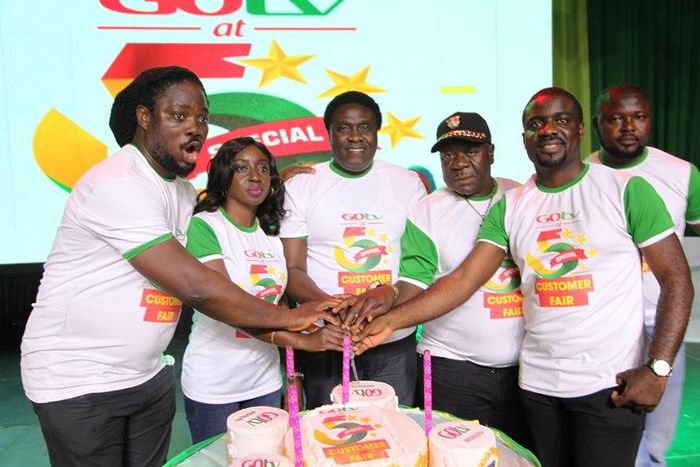 Daddy Showkey(far left), Mr Ibu (second right) and top staff of GOtv