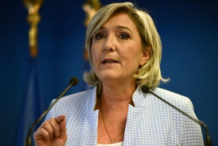 President of the French far-right party and presidential candidate for the 2017 French Presidential elections Marine Le Pen delivers a speech during a press conference on november 9, 2016 in the party headquarters inNanterre, near Paris, following the ...