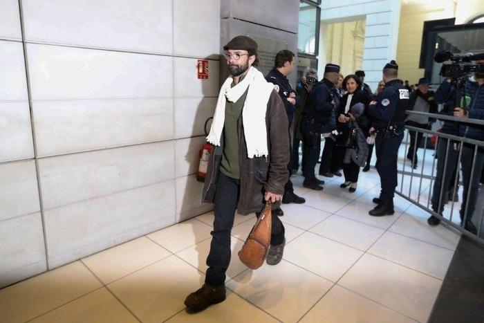 French farmer Cedric Herrou (L) is one of three people to appear before the courts in southern France for assisting migrants fleeing war, poverty and persecution