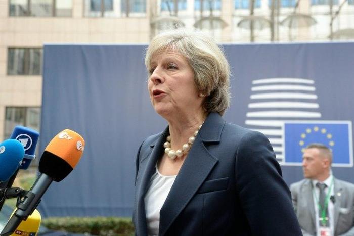 Britain's Prime Minister Theresa May speaks to reporters ahead of a European Union summit in Brussels, on October 20, 2016