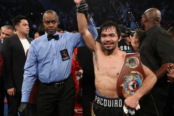 Manny Pacquiao celebrates after his WBO unanimous-decision welterweight victory over Jessie Vargas, at the Thomas & Mack Center in Las Vegas, Nevada, on November 5, 2016