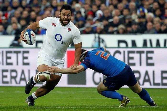 England's prop Mako Vunipola (L) is tackled by France's hooker and captain Guilhem Guirado during the Six Nations international Rugby Union match between France and England March 19, 2016