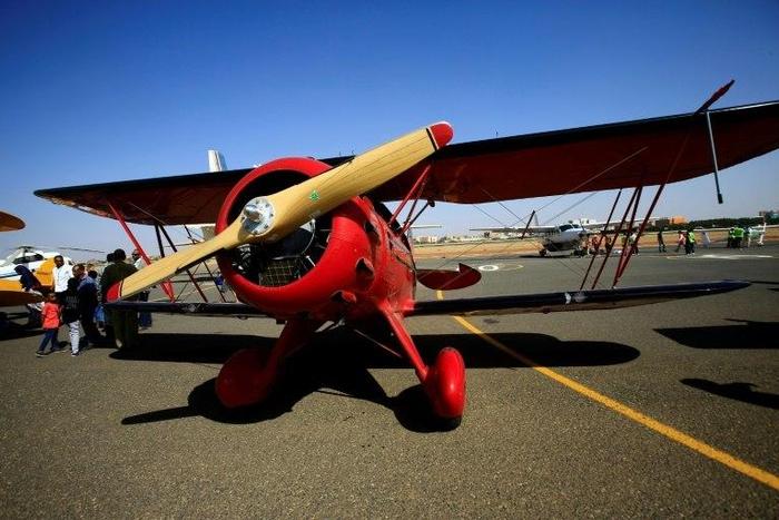A Waco YMF-5D biplane sits on the runway on November 20, 2016 in Khartoum airport during the Vintage Air Rally