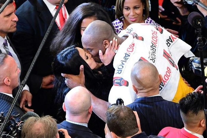 Kobe Bryant of the Los Angeles Lakers kisses his wife Vanness following his last game as a Laker, in Los Angeles, California, on April 13, 2016