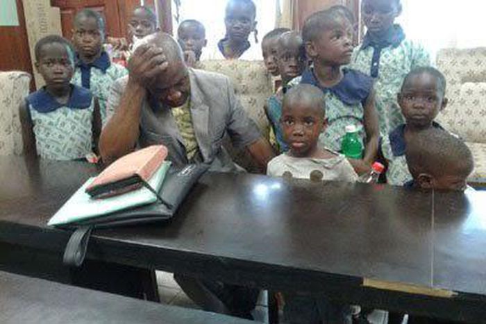 Pastor Onoyngu Chibuike appears sober in a picture of him and the children.
