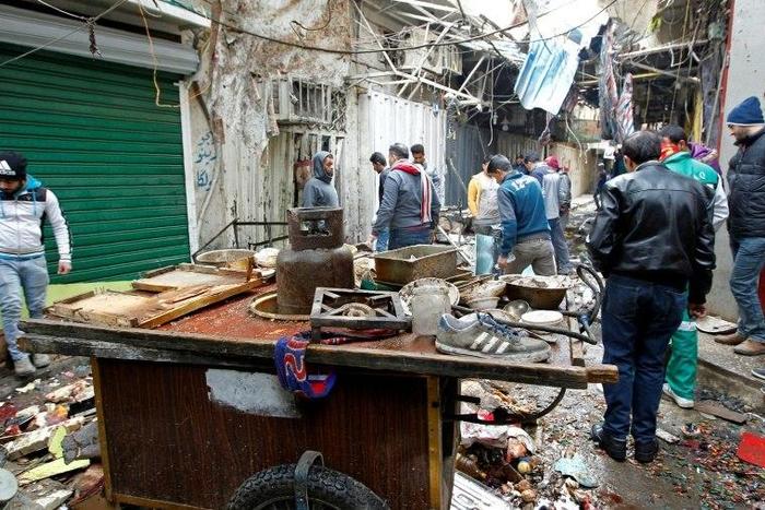 Two suicide bombers attacked Baghdad's central Al-Sinek neighbourhood killing at least 27 people and wounding 53, a police colonel said