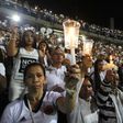 Fans of Atletico Nacional soccer club hold candles as they pay tribute to the players of Brazilian club Chapecoense killed in the recent airplane crash, in Medellin, Colombia, September 30, 2016.   REUTERS/Fredy Builes