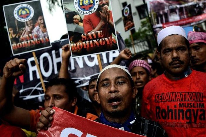 Ethnic Rohingya Muslim refugees shout slogans during a protest against the persecution of Rohingya Muslims in Myanmar, outside the Myanmar embassy in Kuala Lumpur on November 25, 2016
