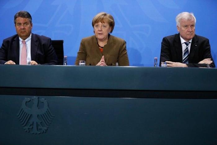 German Vice Chancellor Sigmar Gabriel (L), German Chancellor Angela Merkel (C) and leader of the Christian Social Union (CSU) Horst Seehofer are divided over who to nominate as a potential successor to President Joachim Gauck