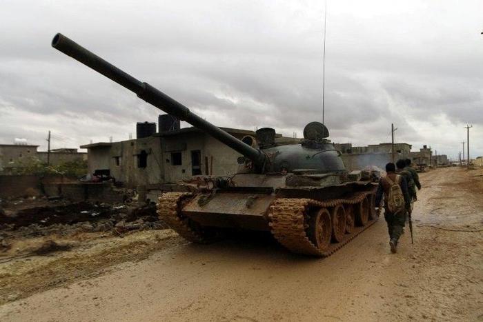Soldiers from the Libyan National Army, led by Khalifa Haftar, advance towards the area of Qanfudah, south of Benghazi, on November 30, 2016