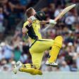 Australia's David Warner celebrates reaching his century against New Zealand in the second one-day international in Canberra on December 6, 2016