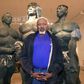 Senegalese sculptor Ousmane Sow posing in front of one of his artworks in Lyon in 1999