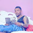 Singer Oritsefemi reading 'Rise of ISIS'