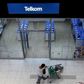 A shopper walks past a Telkom shop at a mall in Johannesburg February 26, 2016.