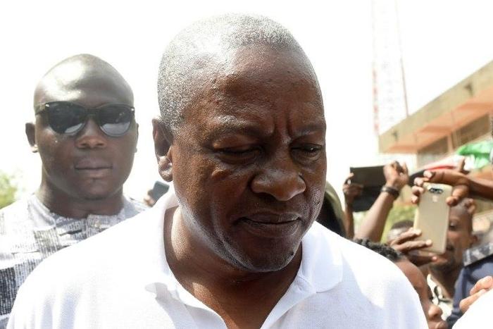 President and candidate of Ghana's ruling National Democratic Congress party John Mahama leaves after voting in the Bole district, northern region, on December 7, 2016