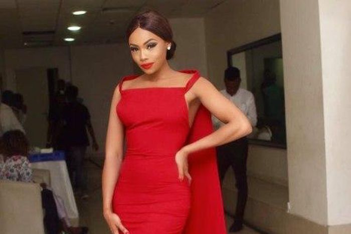 Bonang Matheba in a red embellised Weizdhurm Franklyn frock with stunning cape details