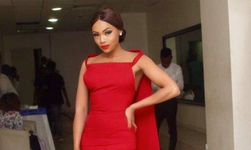 Bonang Matheba in a red embellised Weizdhurm Franklyn frock with stunning cape details