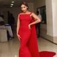 Bonang Matheba in a red embellised Weizdhurm Franklyn frock with stunning cape details
