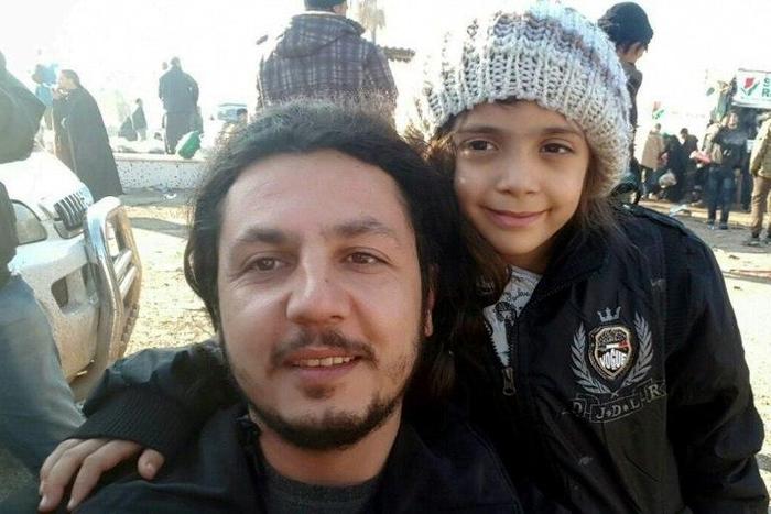 A Humanitarian Relief Foundation worker takes a selfie with seven-year-old Bana al-Abed in Rashidin district in Syria after she was evacuated from Aleppo on December 19, 2016
