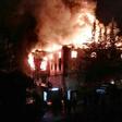 Flames are seen as firefighters try to control a fire at a school in Adana, southern Turkey, on November 29, 2016 that killed 12 people