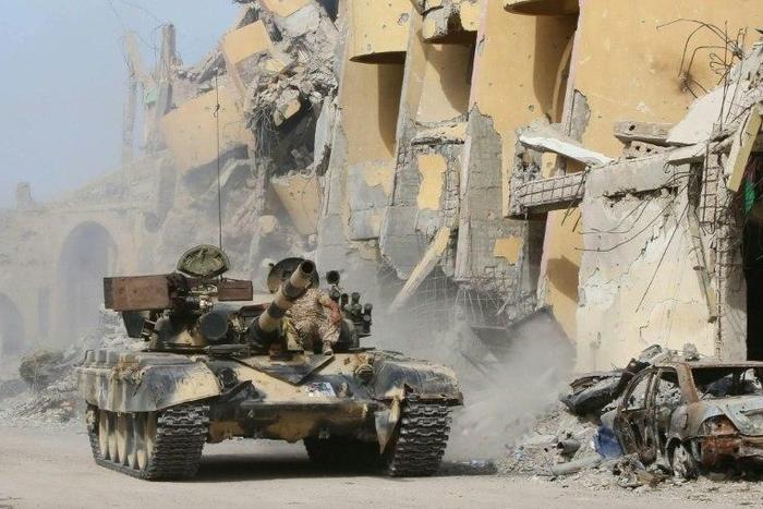 Forces loyal to Libya's UN-backed Government of National Accord roll through Sirte during an operation to clear the Islamic State group from the city, on October 14, 2016