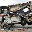 Workers cut away debris from the front of a bus involved in a mass casualty crash on the westbound Interstate 10 freeway near Palm Springs, California October 23, 2016.