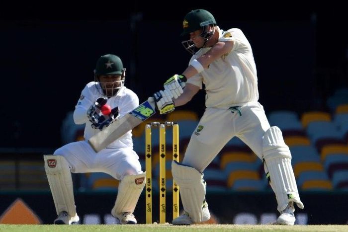 Australia's batsman Steven Smith plays a shot in front of Pakistan's wicketkeeper Sarfraz Ahmed on the third day of their day-night first Test match, in Brisbane, on December 17, 2016