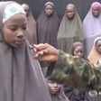 A still image from a video posted by Nigerian Islamist militant group Boko Haram on social media and seen by Reuters on August 14, 2016, shows a girl who identified herself to a masked man as Maina Yakubu and that she is from Chibok, as dozens of other...