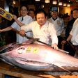 Kiyoshi Kimura (C), president of sushi restaurant chain Sushi-Zanmai, has paid $636,000 for a 212-kilogramme blue fin tuna on the first trading day of 2017 at Tsukiji fish market