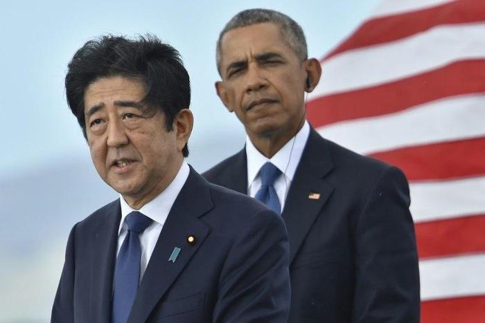 Japan's national broadcaster NHK provided live coverage of the joint addresses of Prime Minister Shinzo Abe (L) and US President Barak Obama