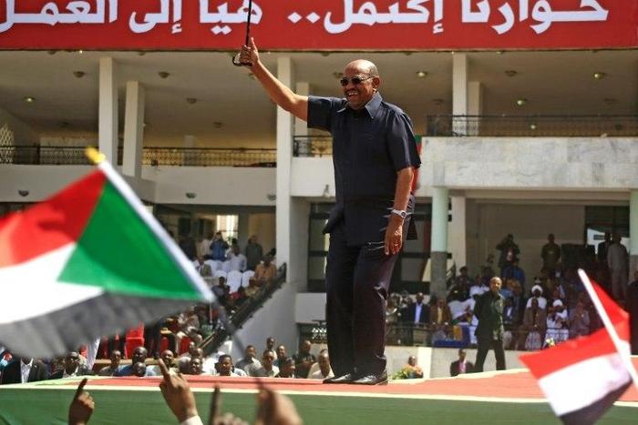Sudanese President Omar al-Bashir (C) vowed to crush any new anti-regime protests as the authorities did three years ago