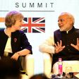 British Prime Minister Theresa May speaks with India's counterpart Narendra Modi as they attend The India-UK Tech Summit in New Delhi, on November 7, 2016