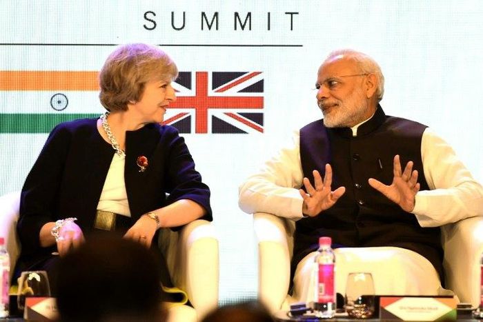 British Prime Minister Theresa May speaks with India's counterpart Narendra Modi as they attend The India-UK Tech Summit in New Delhi, on November 7, 2016