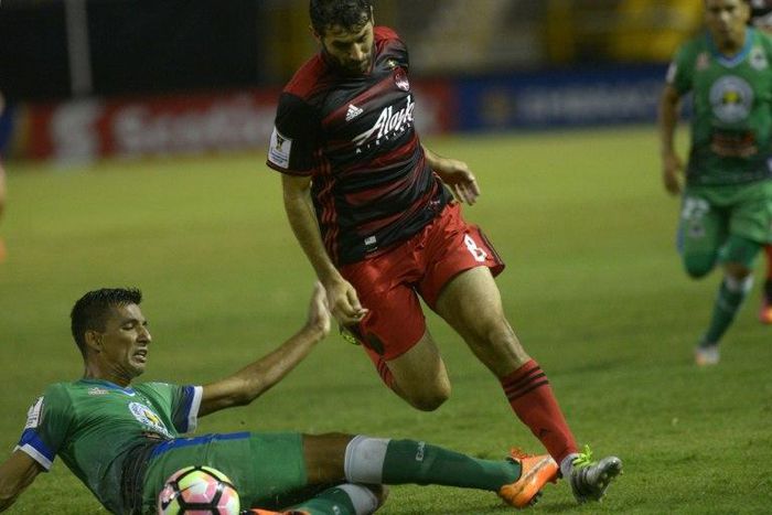 Diego Valeri of Portland Timbers (R) fights for the ball with Raul Gonzales of Salvadorean team C.D. Dragon during a CONCACAF Champions League football match in September