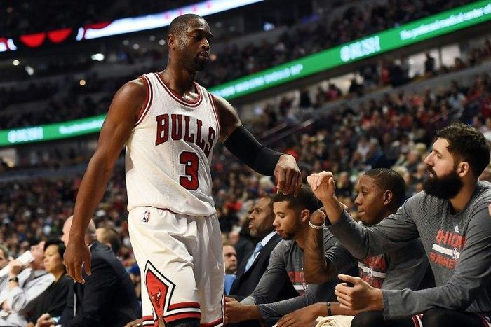 Dwyane Wade of the Chicago Bulls walks to the bench during the second half of a game against the Boston Celtics